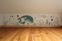 fresque représentant un paysage marin avec une baleine et son baleineau, réalisée dans une chambre d'enfant en Normandie